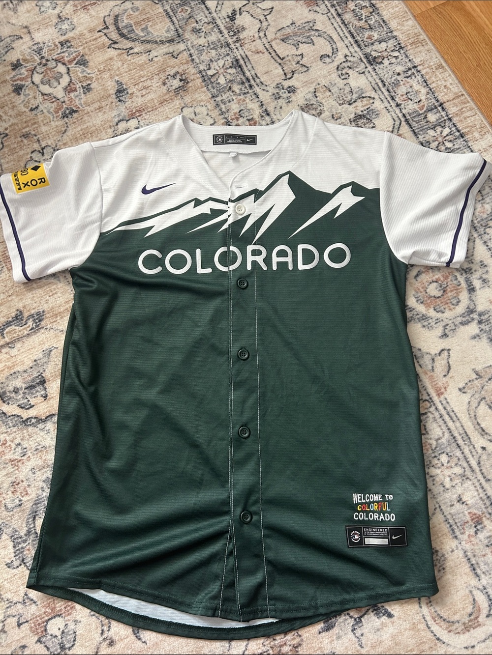 Nike Colorado Green & White Baseball Jersey with Mountain Graphic. Purple detail